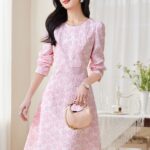 Two tone jacquard waist cinched long sleeved dress